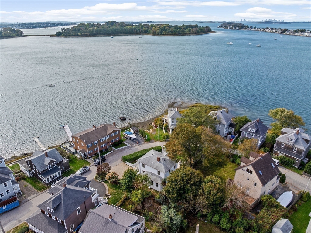 92 Hampton Circle Hull, MA 02045 - Photo 27 of 28 an aerial view of a house with a lake view