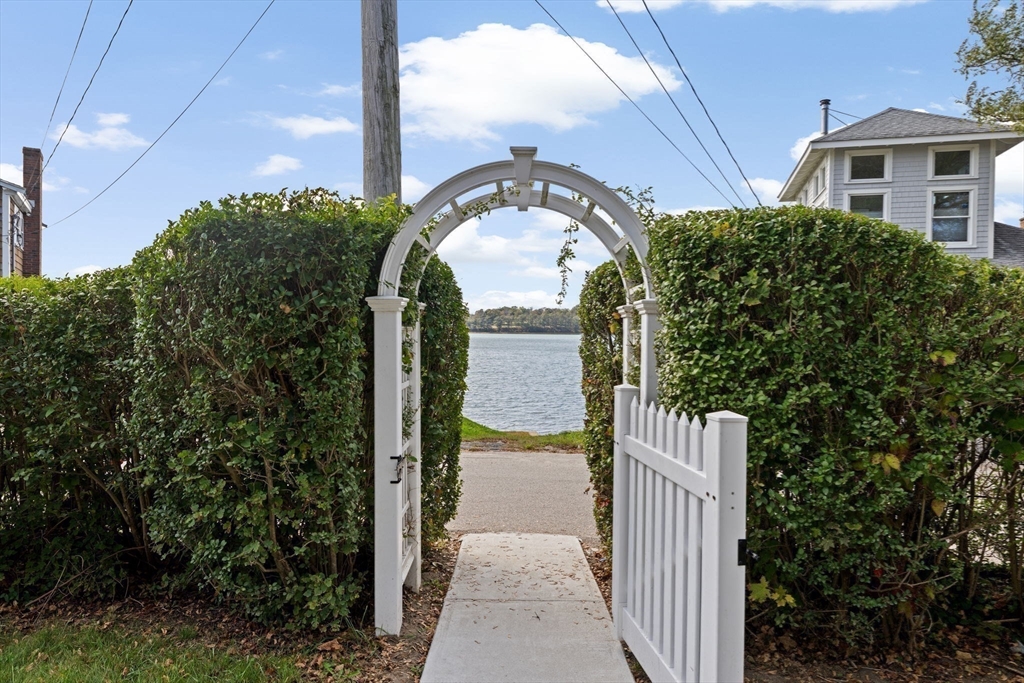 92 Hampton Circle Hull, MA 02045 - Photo 8 of 28 a front view of a house with a garden