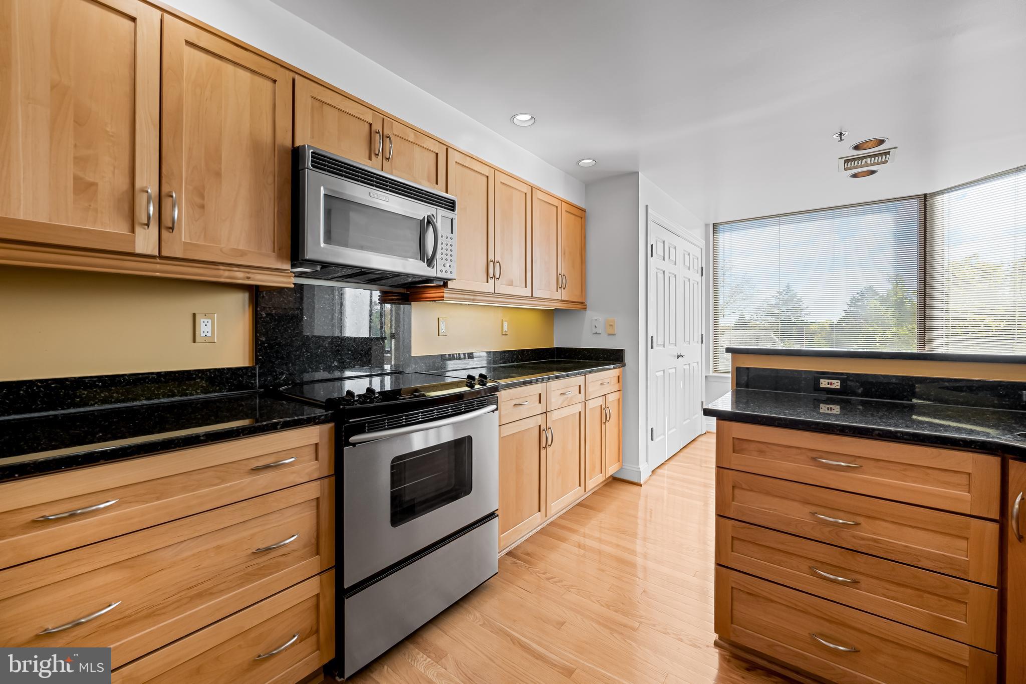 3704 North Charles Street, Unit 406 Baltimore, MD 21218 - Photo 12 of 65 Stainless steel appliances in renovated kitchen