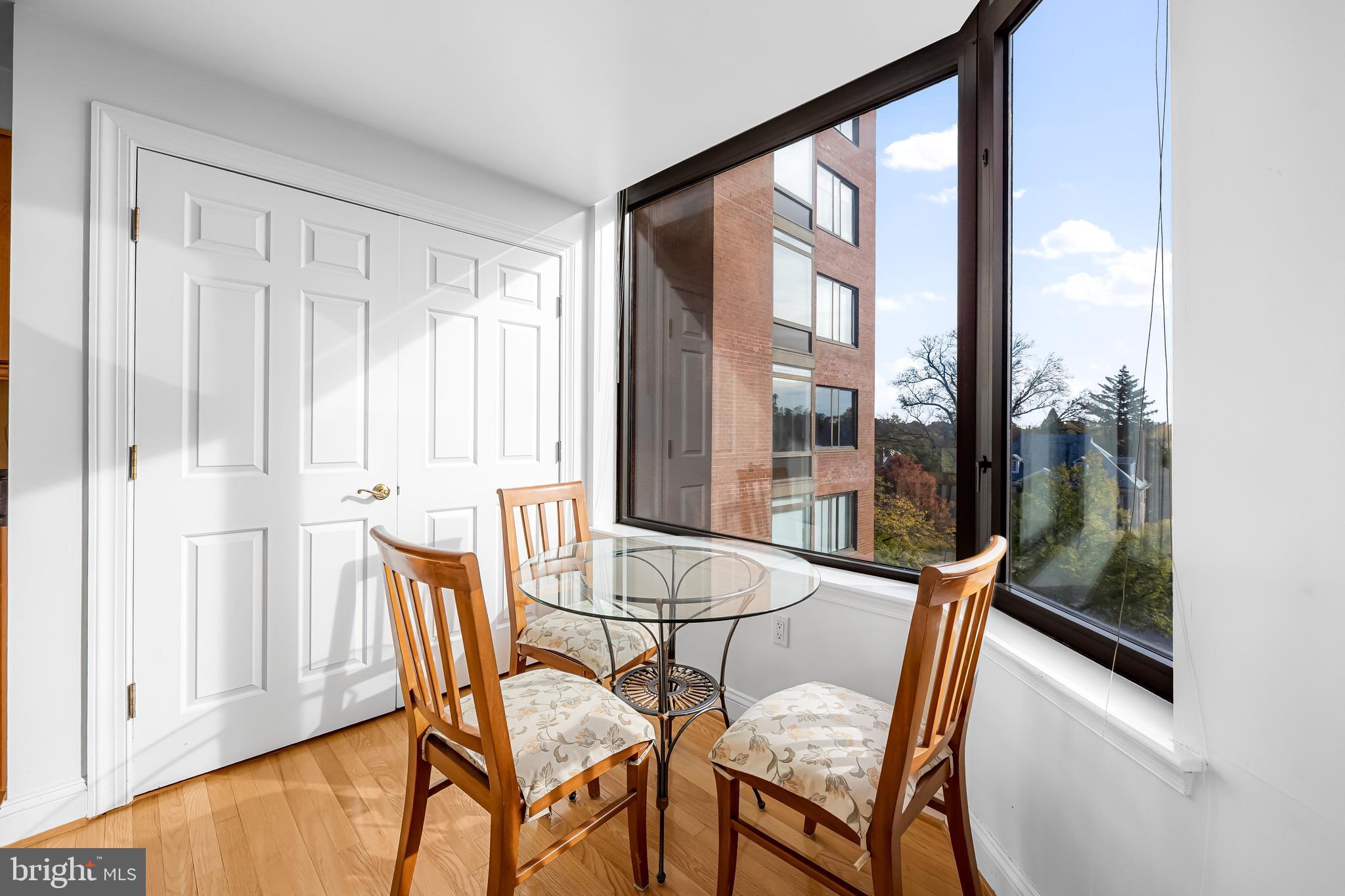 3704 North Charles Street, Unit 406 Baltimore, MD 21218 - Photo 15 of 65 a view of a dining room with furniture and wooden floor