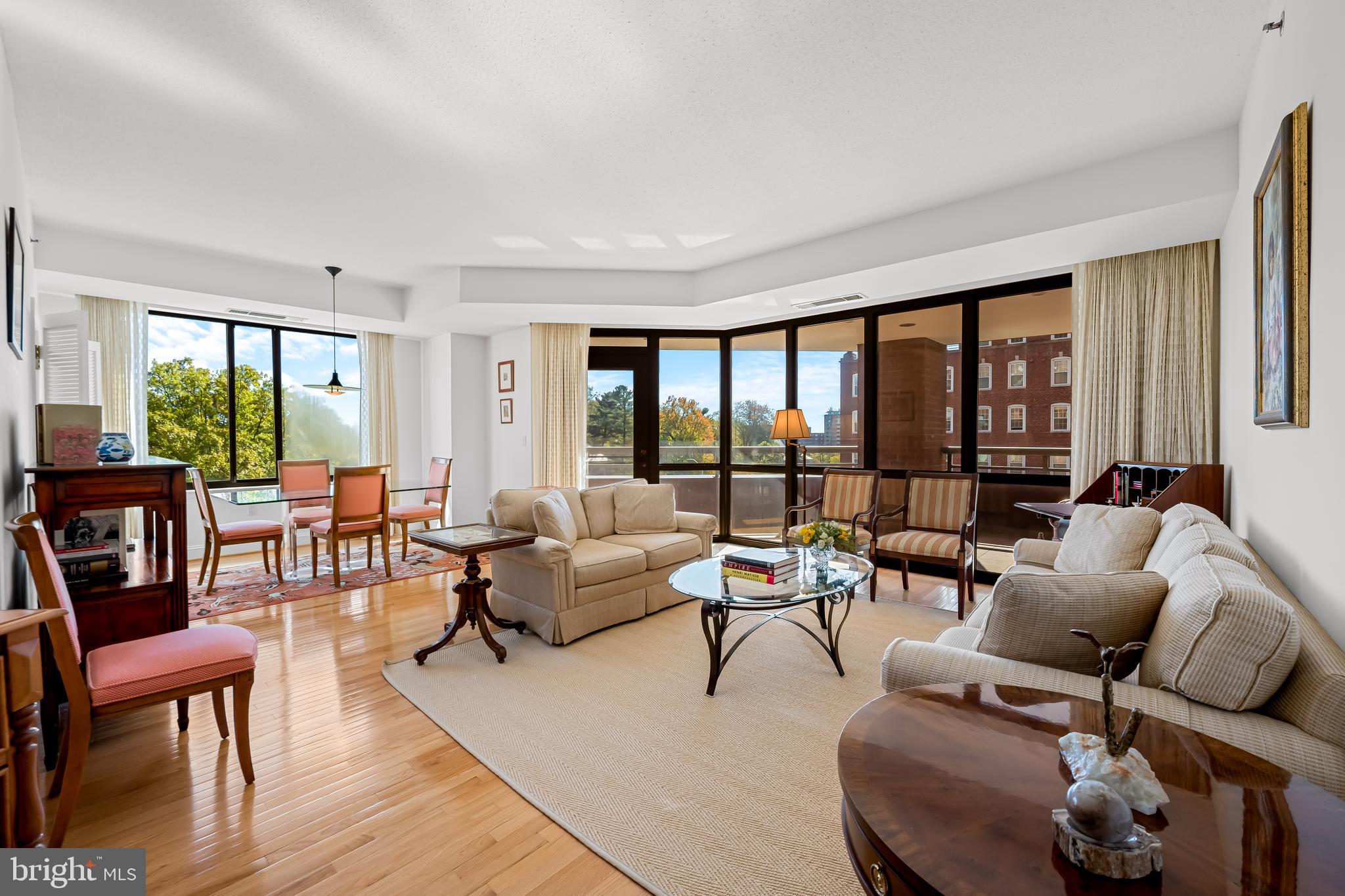 3704 North Charles Street, Unit 406 Baltimore, MD 21218 - Photo 16 of 65 a living room with furniture and a large window