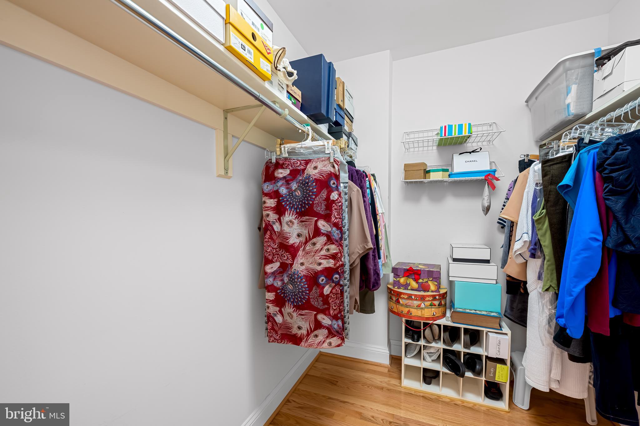 3704 North Charles Street, Unit 406 Baltimore, MD 21218 - Photo 23 of 65 a view of walk in closet with clothes and shoes