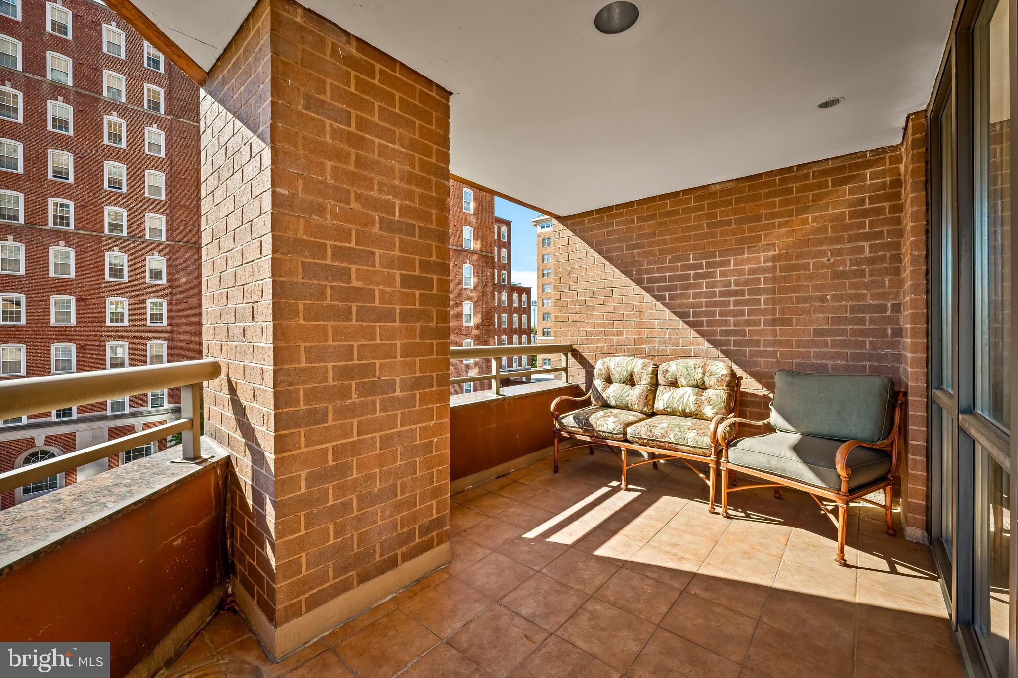 3704 North Charles Street, Unit 406 Baltimore, MD 21218 - Photo 42 of 65 a balcony with chairs and stairs