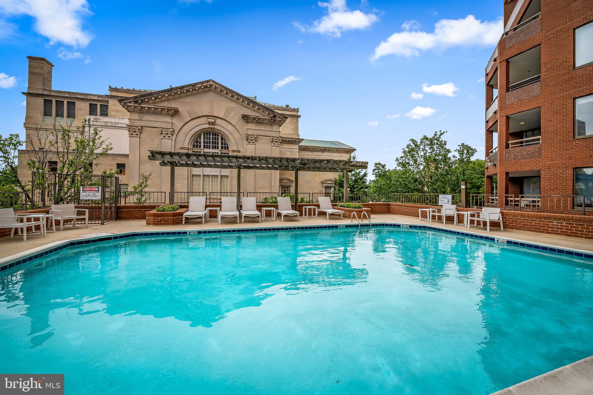 3704 North Charles Street, Unit 406 Baltimore, MD 21218 - Photo 48 of 65 a view of a swimming pool with lounge chair