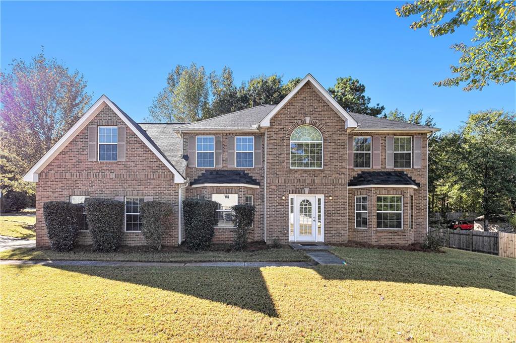 201 Ray Manor Hampton, GA 30228 - Photo 1 of 1 a front view of a house with a yard