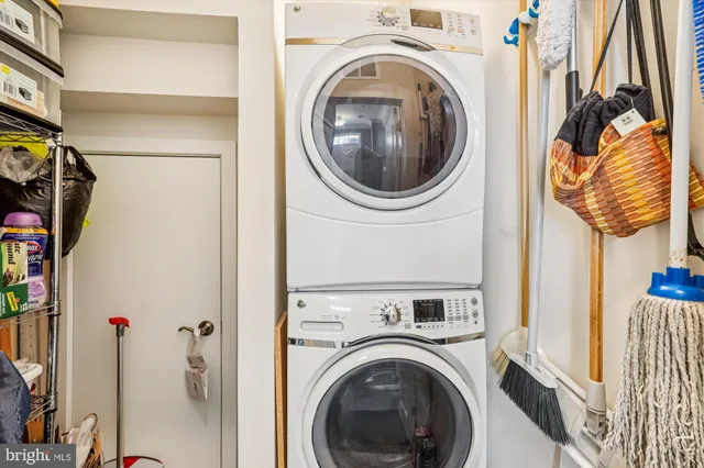a view of a hallway with washer and dryer