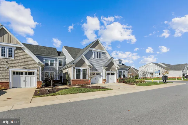 a view of multiple houses with a street