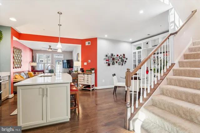 a view of kitchen with furniture and wooden floor