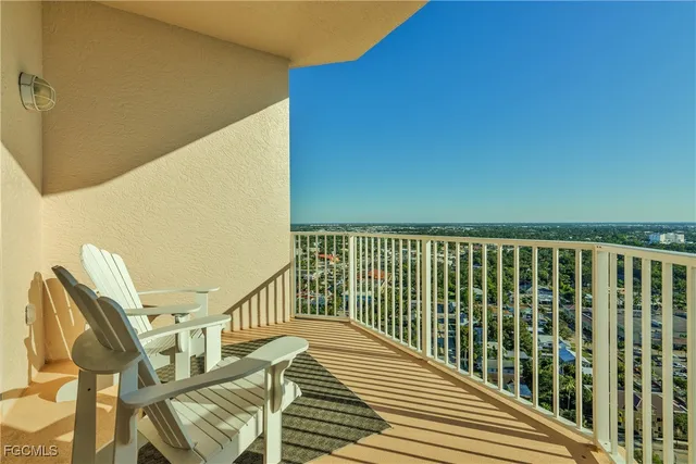 a view of balcony with wooden floor