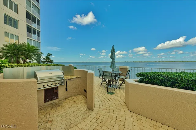 a view of a patio with a table and chairs