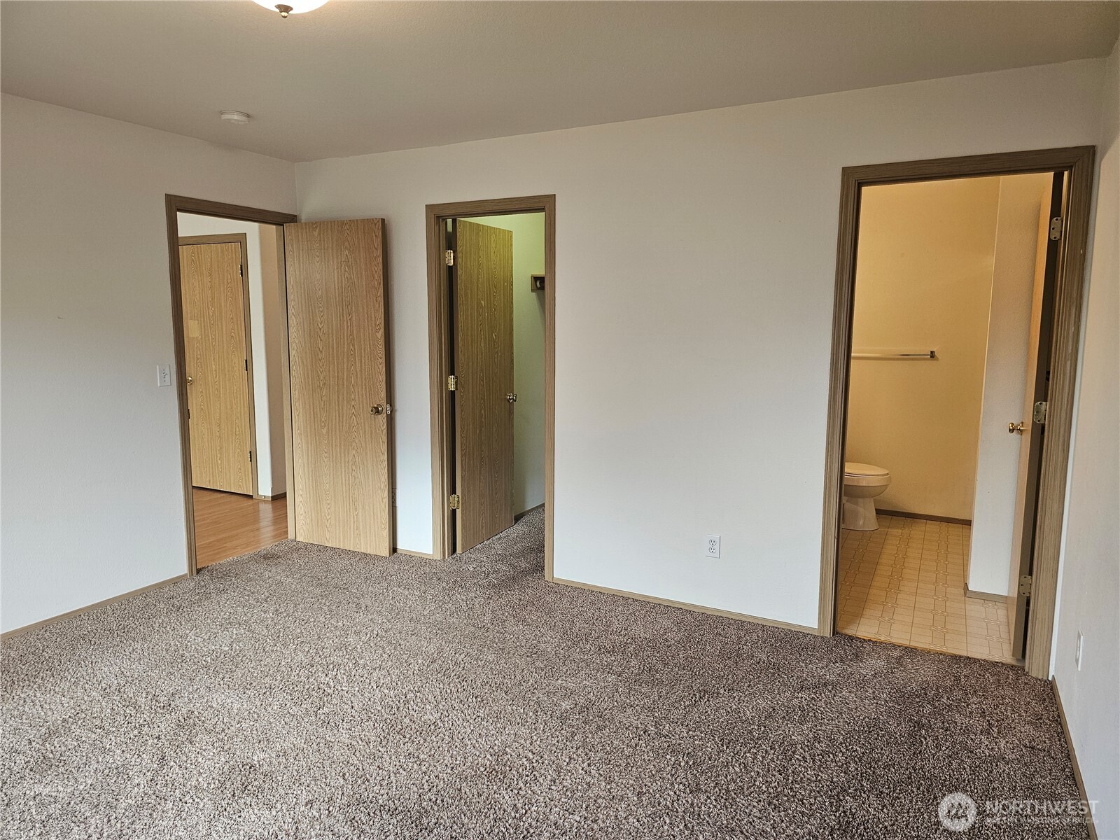 9814 Greenleaf Loop Southeast Yelm, WA 98597 - Photo 14 of 33 a view of an empty room and a bathroom