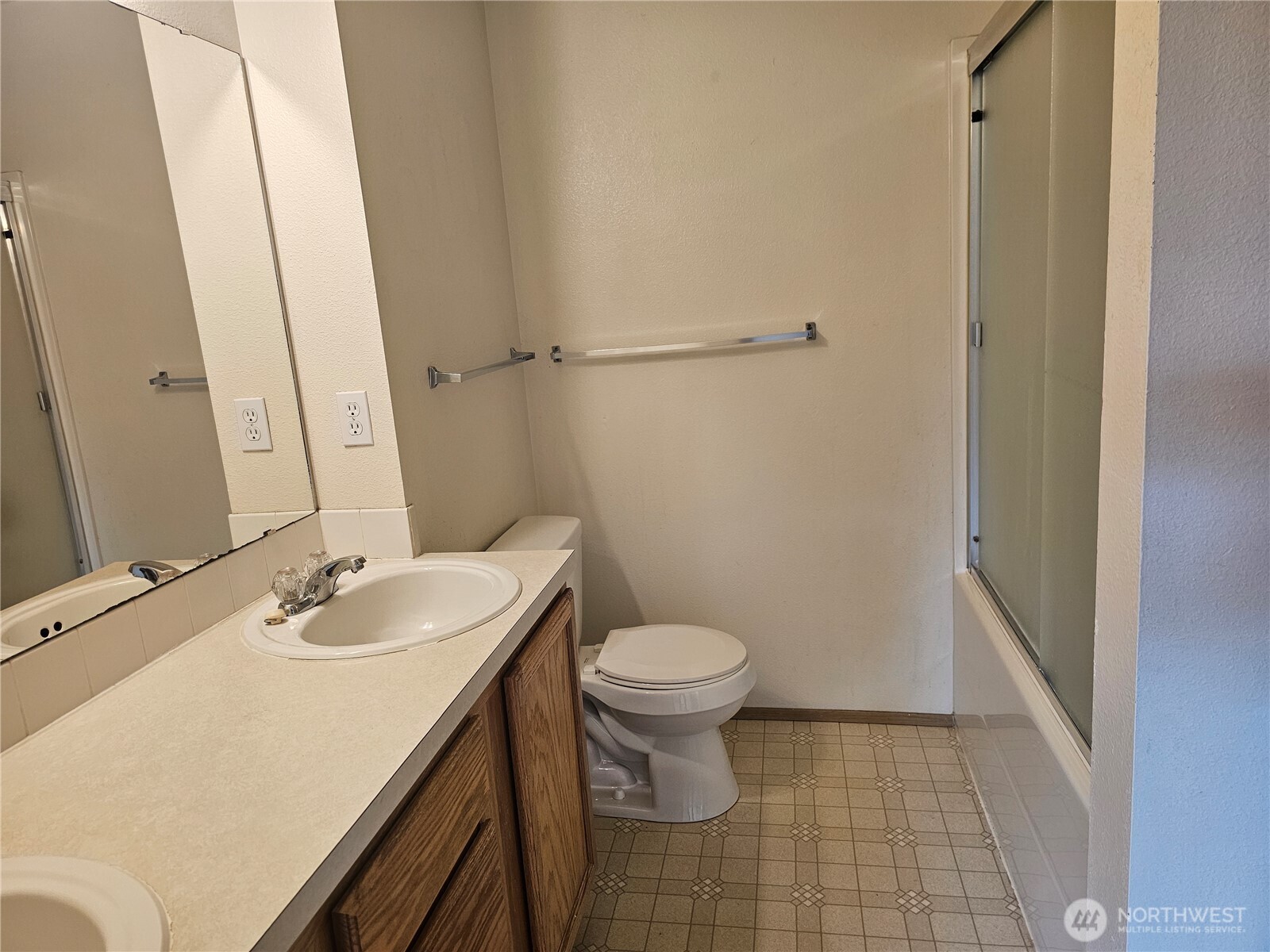 9814 Greenleaf Loop Southeast Yelm, WA 98597 - Photo 16 of 33 a bathroom with a sink and a toilet