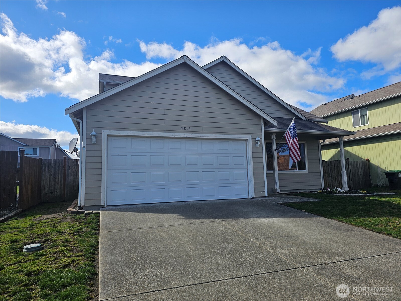 9814 Greenleaf Loop Southeast Yelm, WA 98597 - Photo 2 of 33 a front view of house with garage