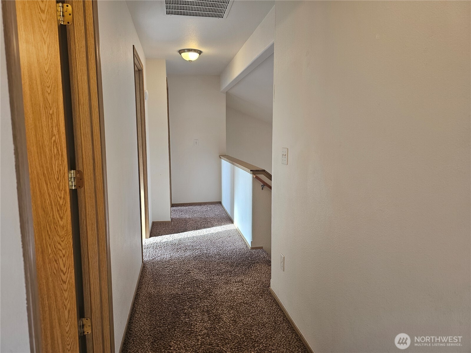 9814 Greenleaf Loop Southeast Yelm, WA 98597 - Photo 21 of 33 a view of a hallway with hallway