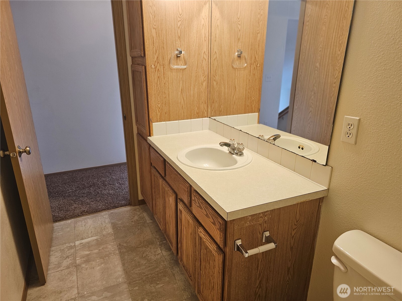 9814 Greenleaf Loop Southeast Yelm, WA 98597 - Photo 25 of 33 a bathroom with a sink a toilet and vanity