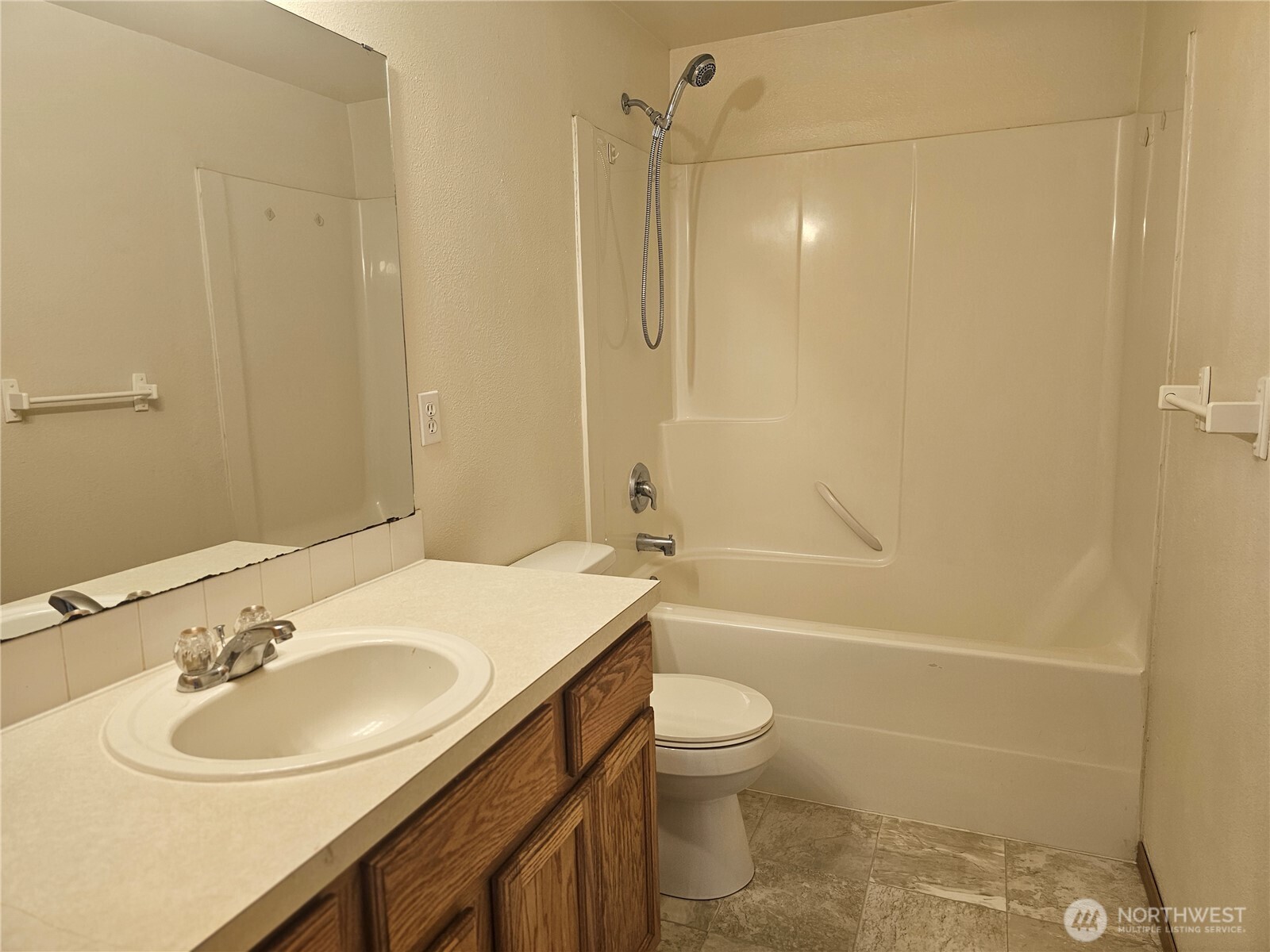 9814 Greenleaf Loop Southeast Yelm, WA 98597 - Photo 26 of 33 a bathroom with a sink toilet tub and shower