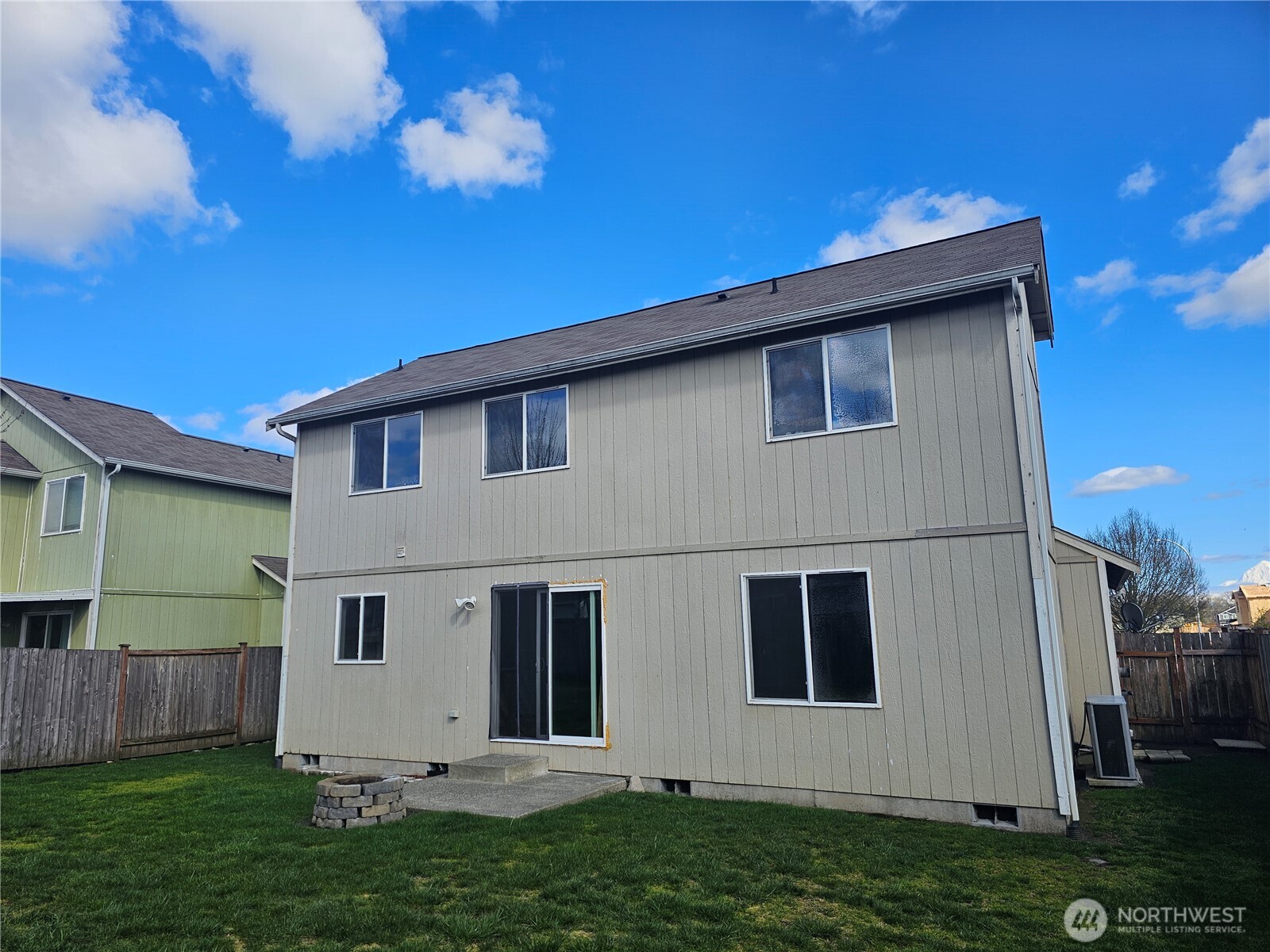 9814 Greenleaf Loop Southeast Yelm, WA 98597 - Photo 31 of 33 a backyard of a house with lots of green space
