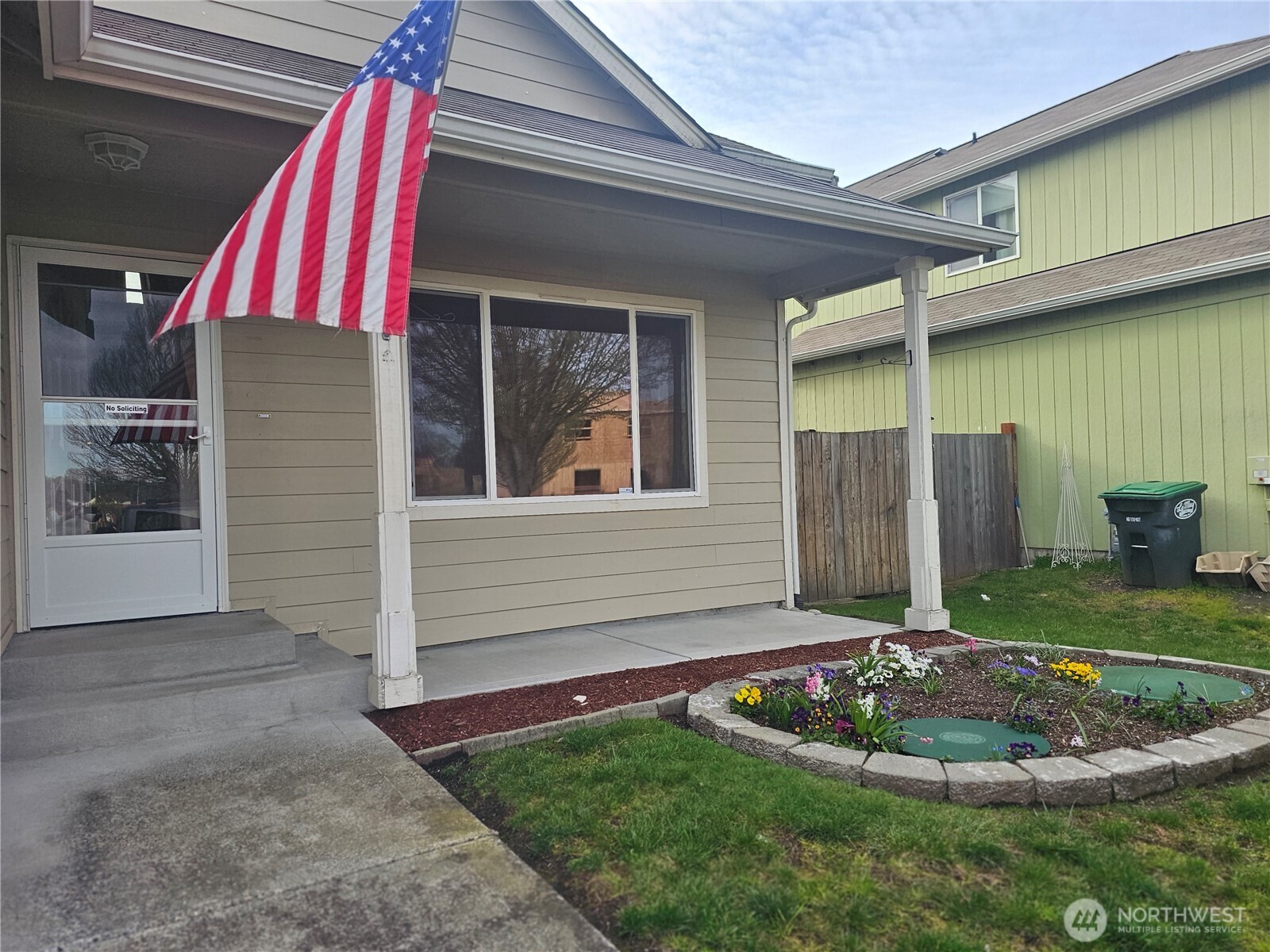 9814 Greenleaf Loop Southeast Yelm, WA 98597 - Photo 5 of 33 a front view of a house with a yard and garage