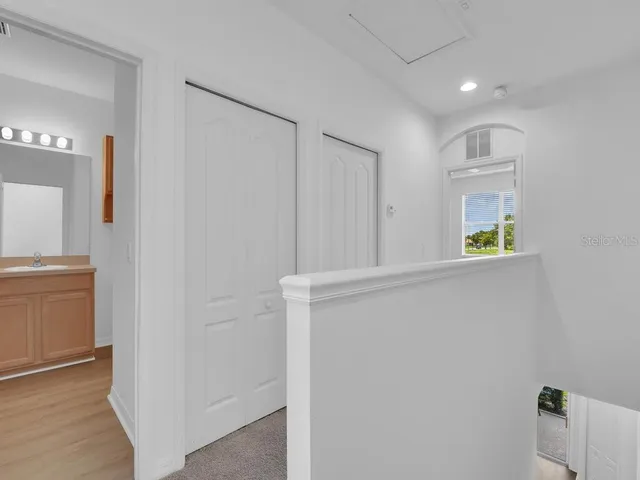 a view of an entryway with wooden floor