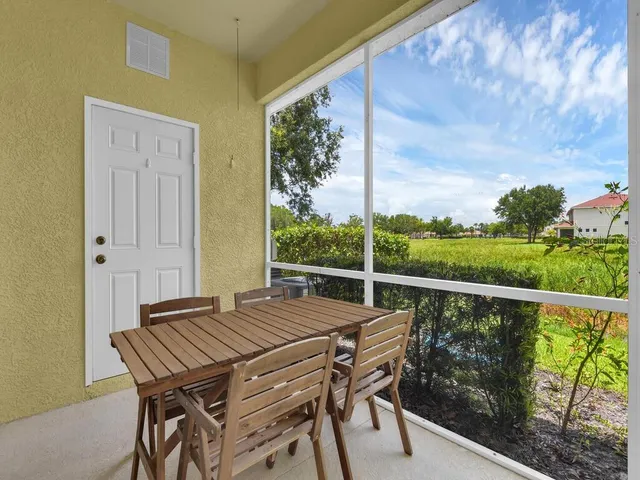 a balcony view with a seating space
