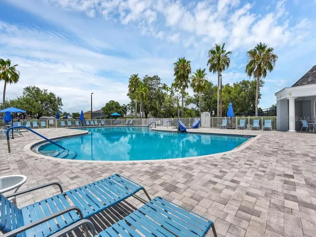 a view of a swimming pool with a patio