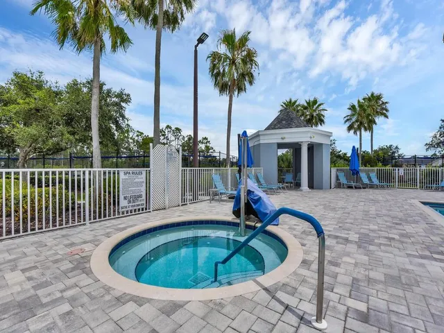 a swimming pool with yard and outdoor seating