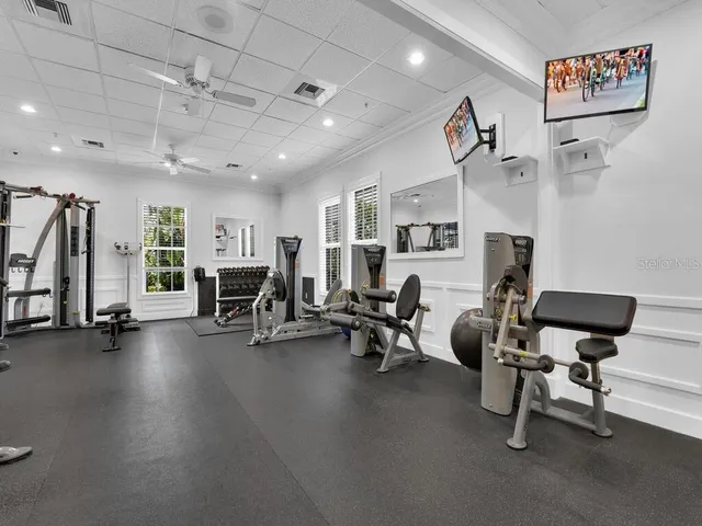 a view of a livingroom with workspace and a window
