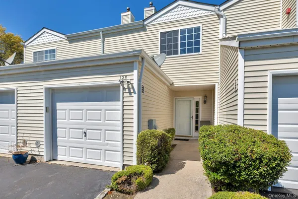 a view of a house with a garage
