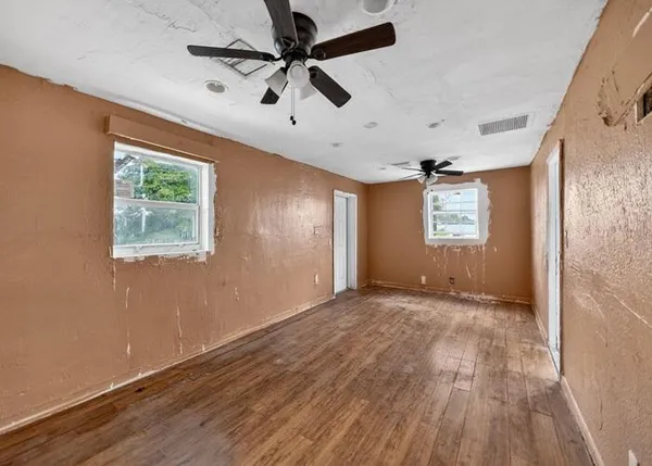 a view of empty room with windows