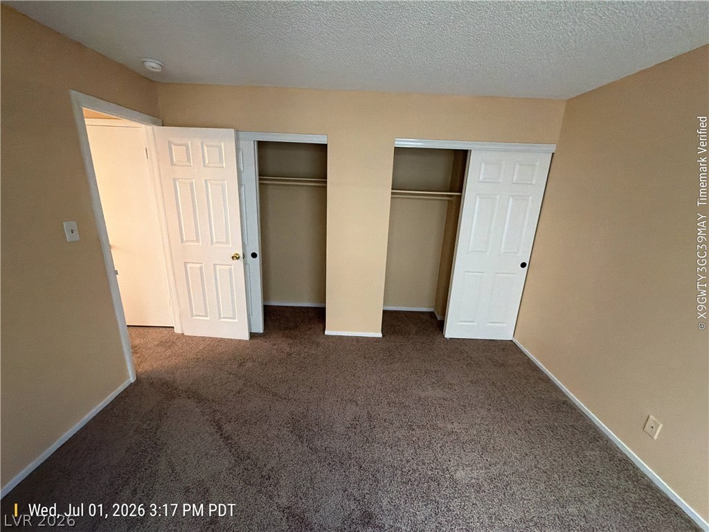 2313 Ragland Street Las Vegas, NV 89108 - Photo 8 of 11 A comfortable bedroom features plush carpeting and convenient closet space.
