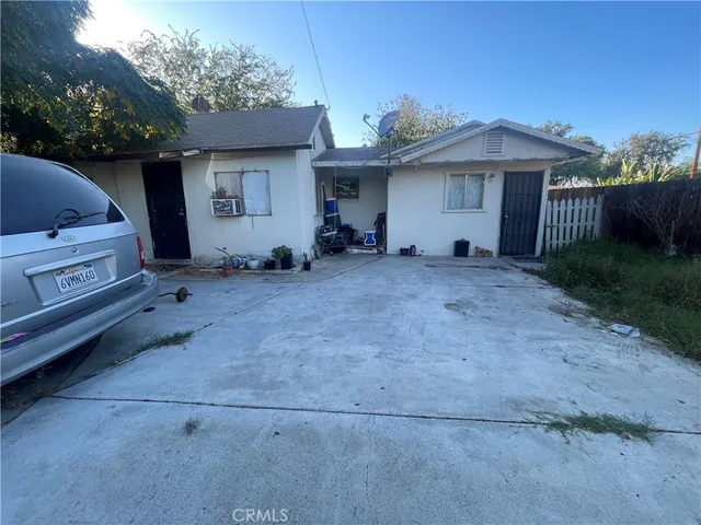 a view of a house with a backyard and balcony