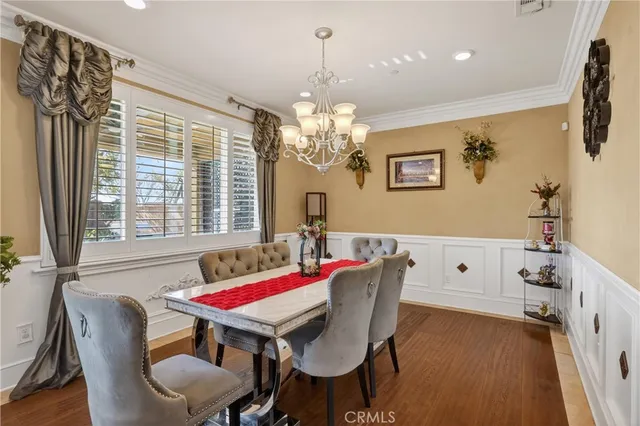 a view of a dining room with furniture and window