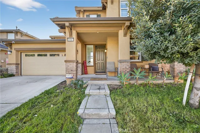 a view of a patio with table and chairs and potted plants