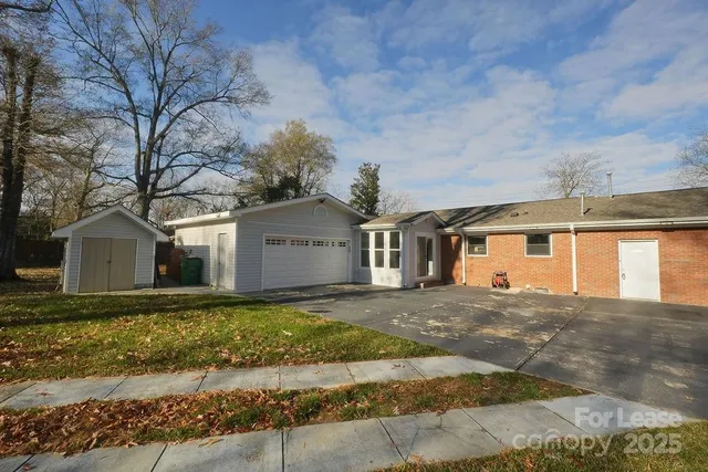 a swimming pool with trees in the background