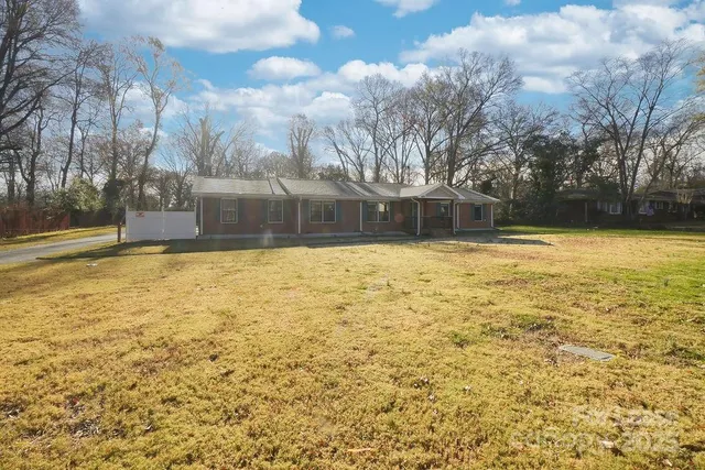 a swimming pool with trees in the background