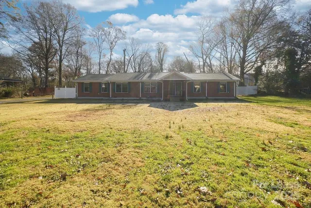 a view of a house with snow on the yard