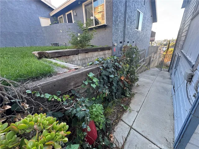 a view of a kitchen with a sink and wooden floor