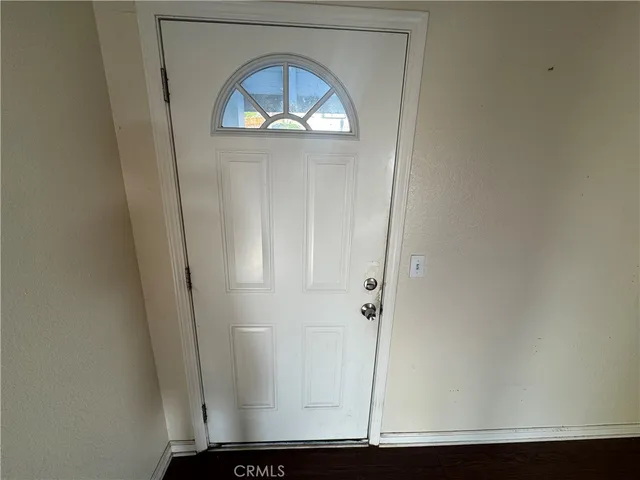 a kitchen with stainless steel appliances a sink a stove a refrigerator and cabinets