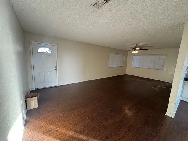 a white toilet sitting next to a shower