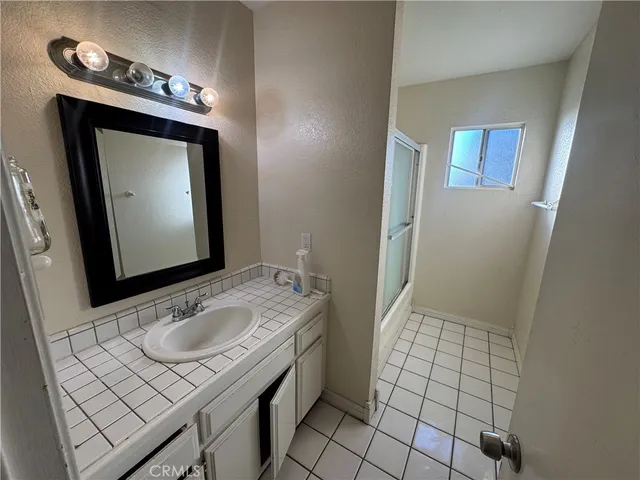 a view of balcony with wooden floor