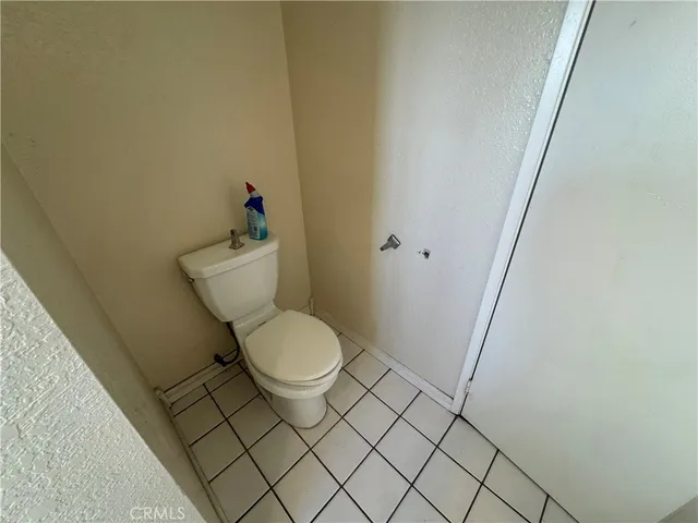 a bathroom with a glass door shower and toilet