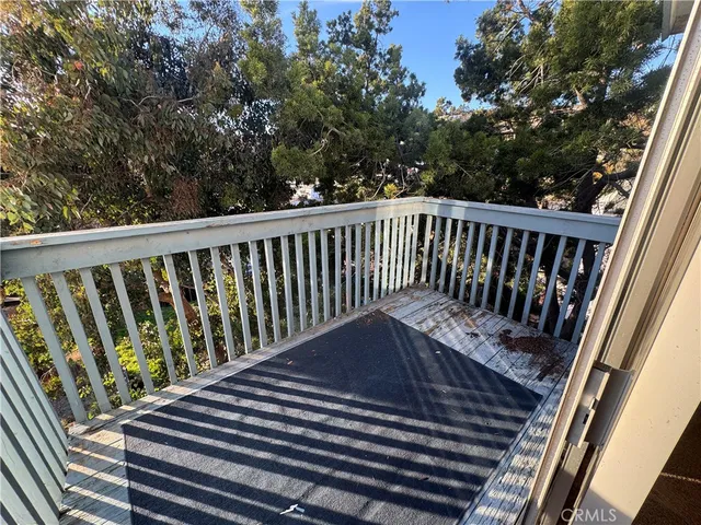 an empty room with a ceiling fan and a window