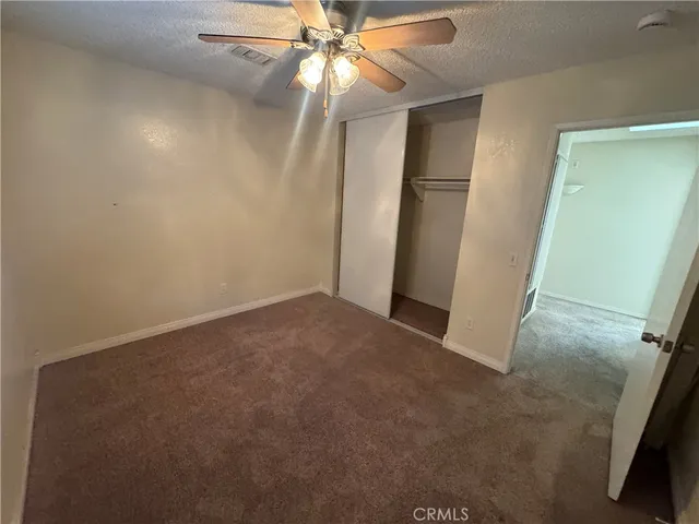 a bathroom with a shower and toilet
