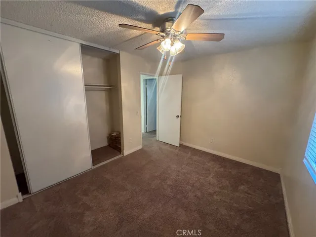 a white toilet sitting next to a shower