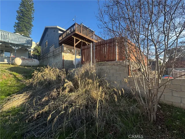 a view of a swimming pool with a yard