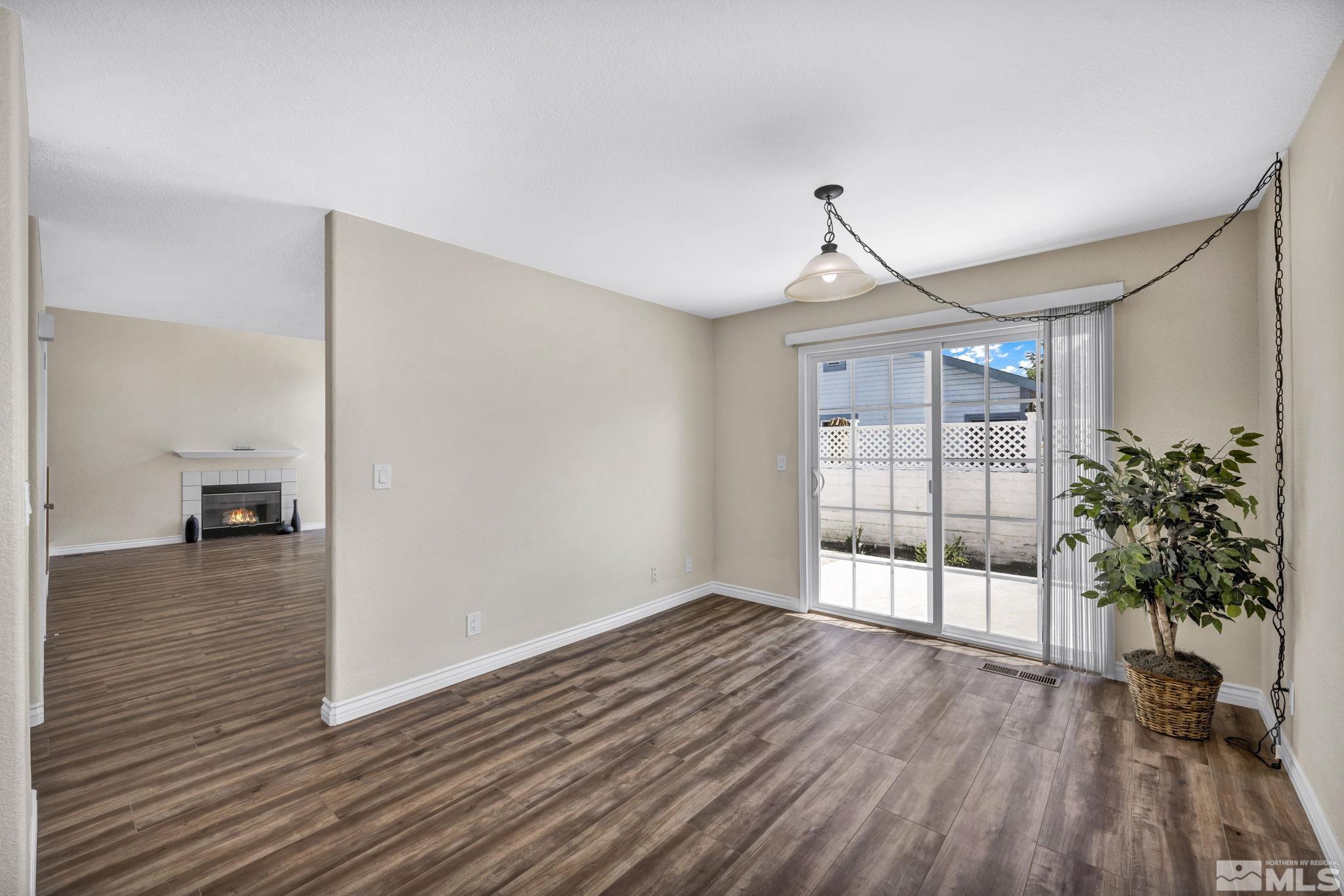 7491 Wheeldale Circle Reno, NV 89511 - Photo 11 of 33 a view of a room with wooden floor and a window