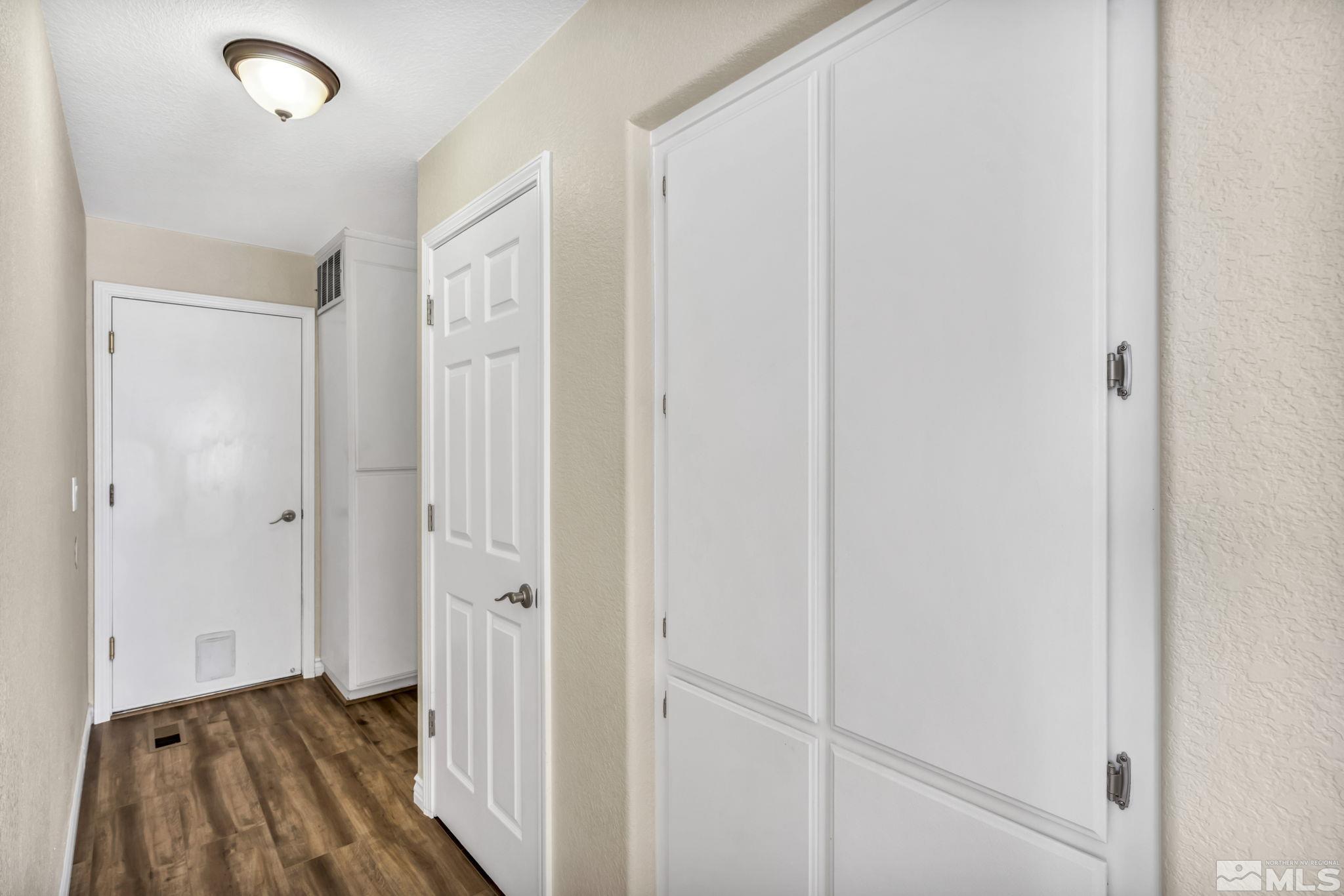 7491 Wheeldale Circle Reno, NV 89511 - Photo 14 of 33 a view of a hallway with wooden floor and staircase