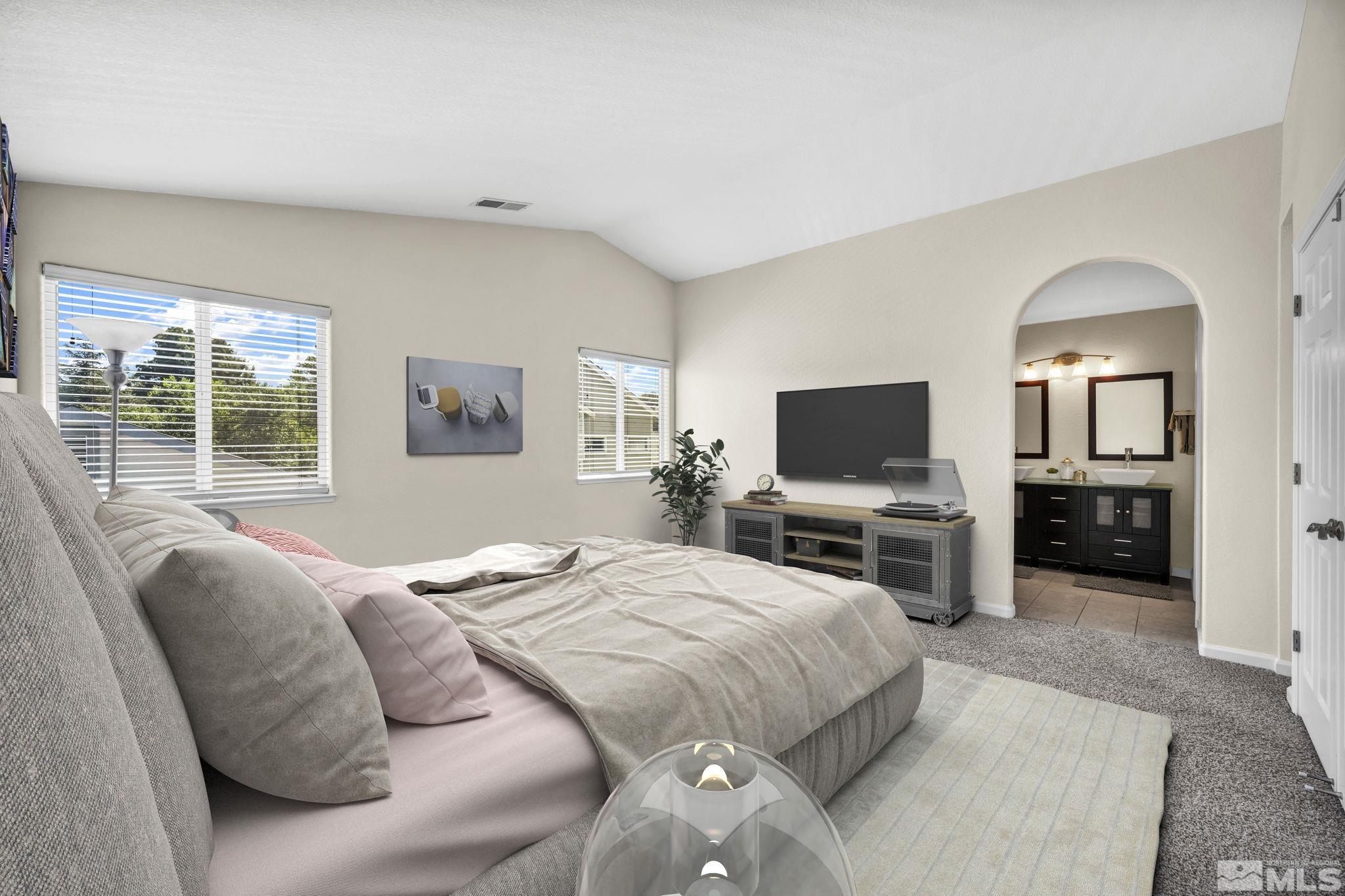 7491 Wheeldale Circle Reno, NV 89511 - Photo 18 of 33 a bedroom with a bed and a television