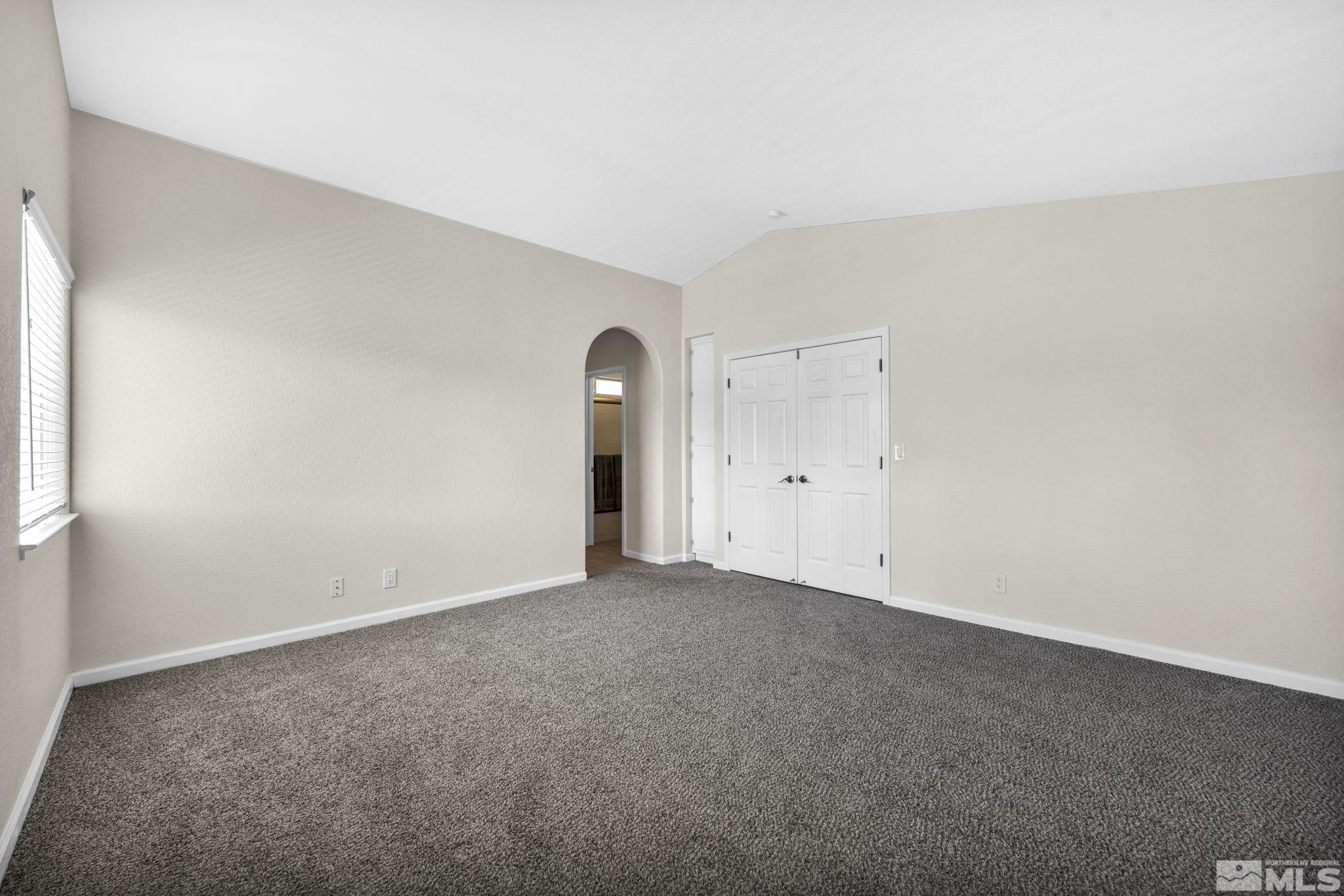 7491 Wheeldale Circle Reno, NV 89511 - Photo 21 of 33 an empty room with an entryway