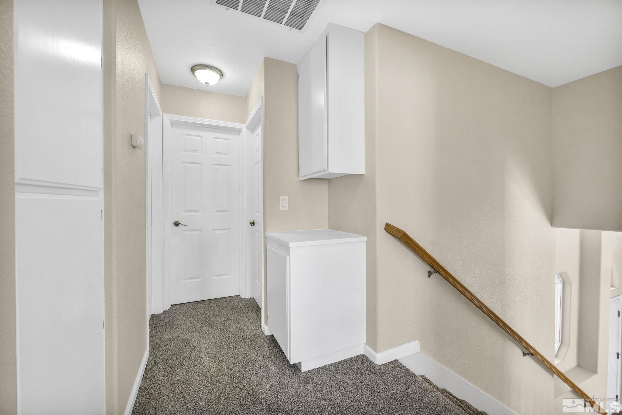 7491 Wheeldale Circle Reno, NV 89511 - Photo 24 of 33 a view of hallway with washer and dryer